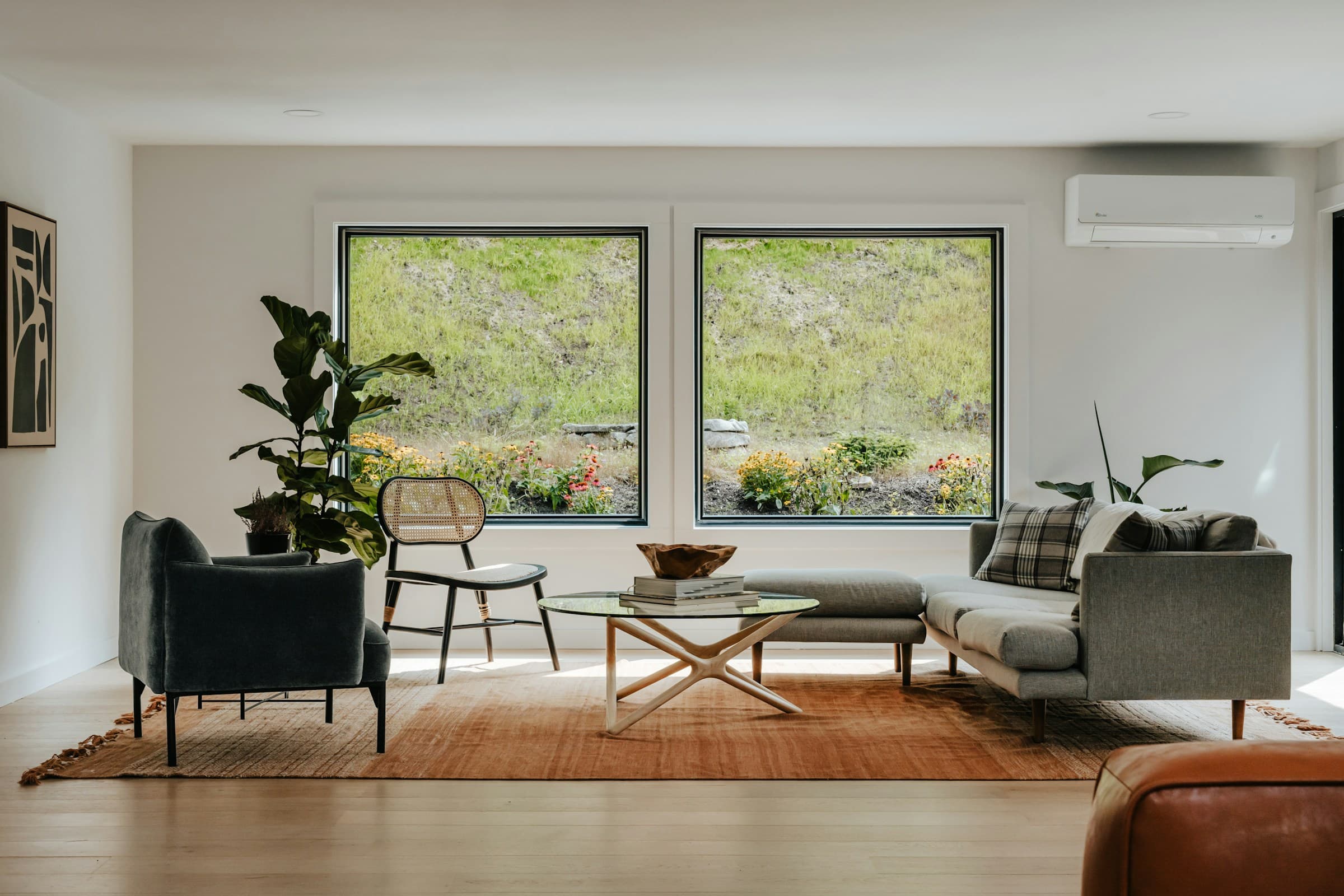 Wall-mounted split system installed in a bright, modern living room